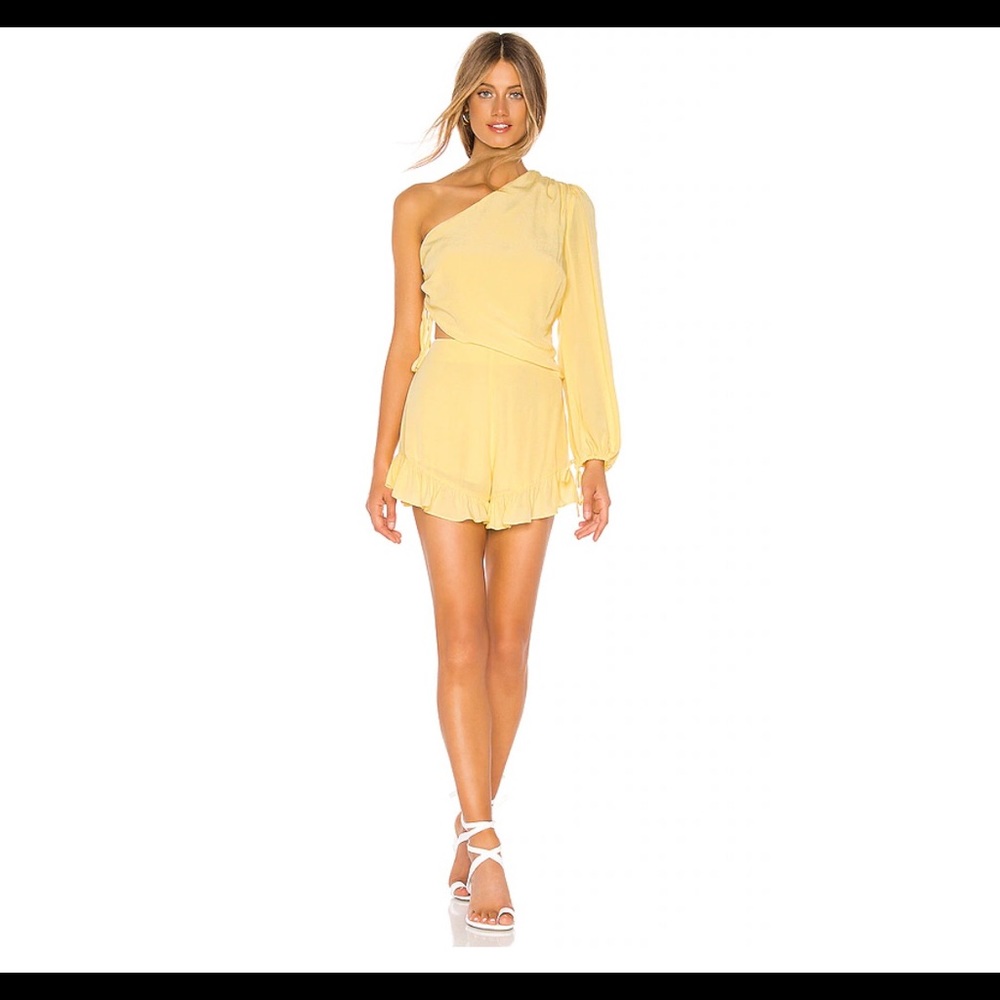 Yellow romper with single sleeve and cutouts